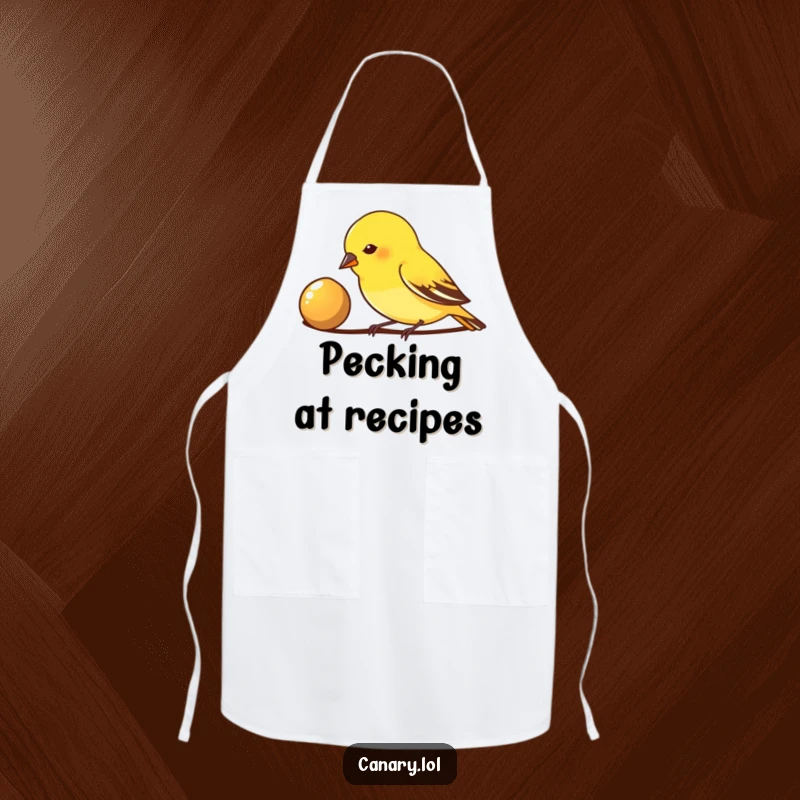 Funny Apron: A small canary bird pecks enthusiastically at a shiny seed, adding a focused and humorous touch to culinary endeavors.
