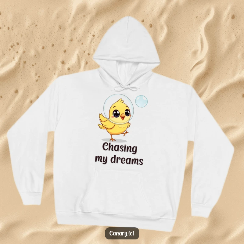 Funny canary bird hoodie, joyful eyes, chasing a floating soap bubble, warm and cheerful apparel.