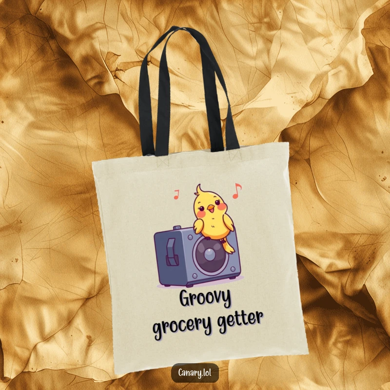 Funny tote bag featuring a jubilant canary bird bobbing its head to music on a speaker, a stylish and humorous accessory.